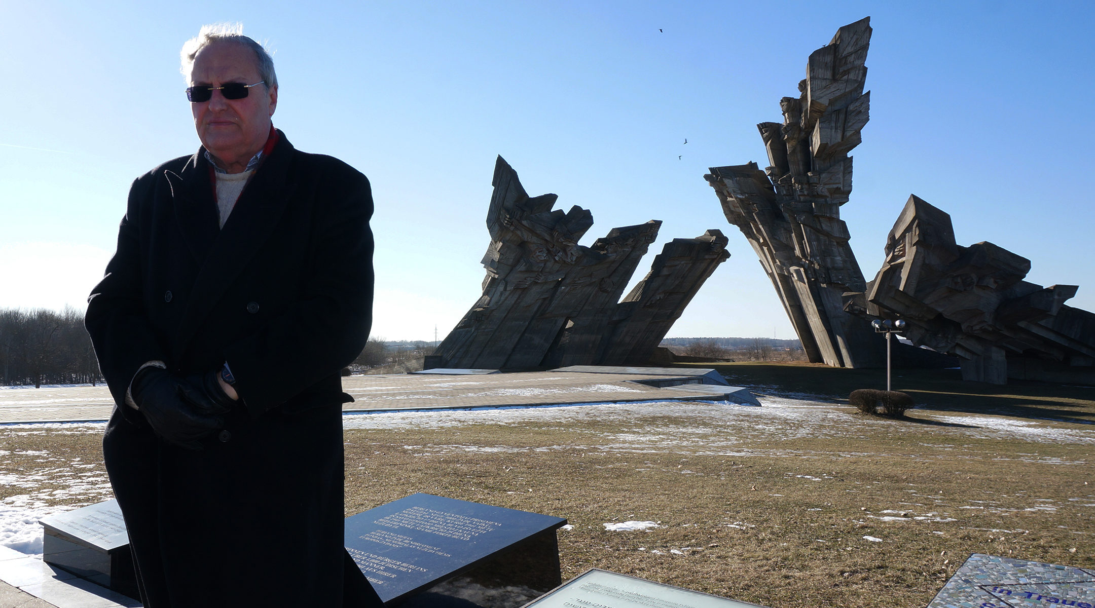 Nazi-hunter Efraim Zuroff saying Kadish, a mourning prayer, for Holocaust victims near Kaunas, Lithuania on Feb. 15, 2015. (Cnaan Liphshiz/JTA)