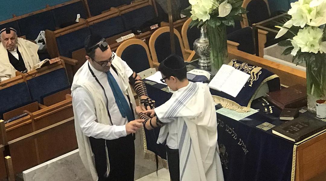 Because of bans on large gatherings, Ruben Golran, an Italian Jewish kid celebrating his bar mitzvah, had to limit the ceremony to close relatives. (Courtesy of the Golran family)