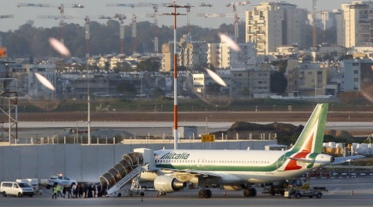 Travelers from Italy board an Alitalia plane after they were denied entry to Israel at Ben Gurion International Airport near Tel Aviv on February 27, 2020. (Jack Guez/AFP via Getty Images)