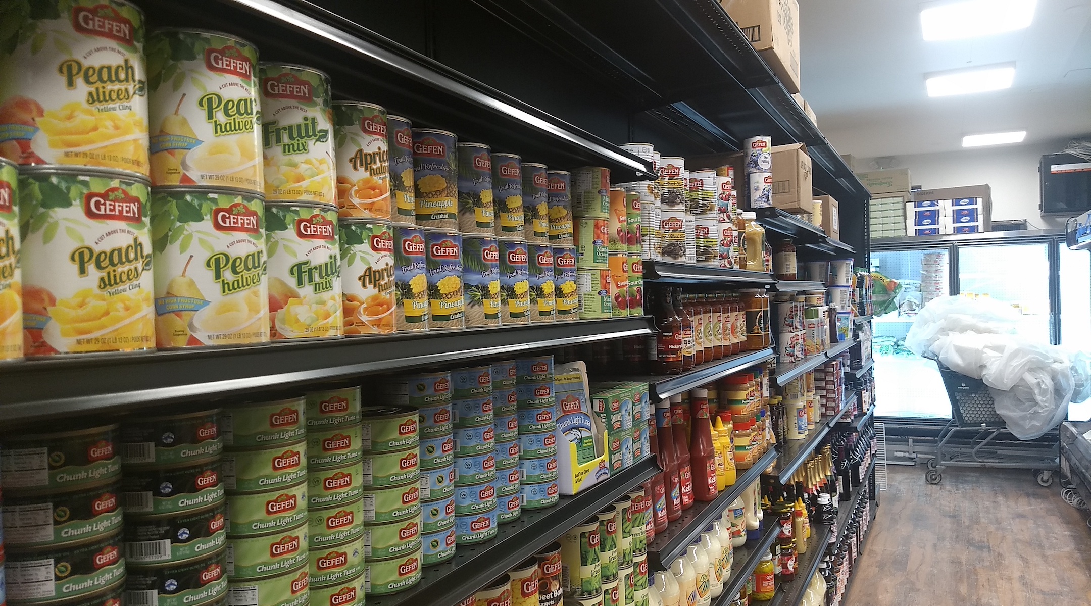 Some of JC Kosher's shelves are fully stocked with staples in its new location, two blocks away from the original store. (Ben Sales)