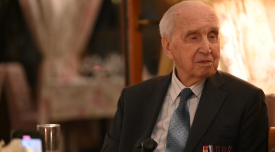 Jozef Walaszczyk, who saved more than 50 Jews during the Holocaust, tells his story at a restaurant in Warsaw, Poland on Jan. 28, 2020. (Cnaan Liphshiz)