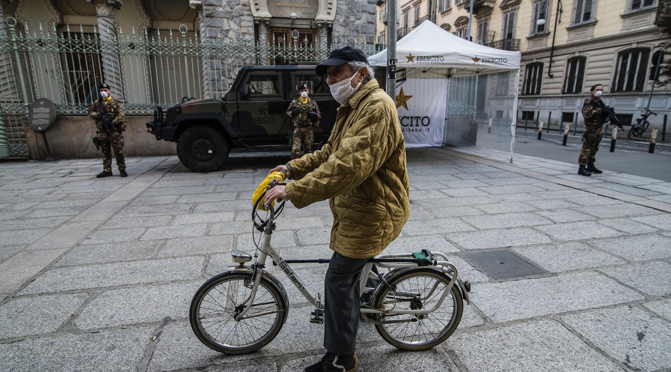 A man rides a bike in front of a synagogue in Turin, Italy, March 18, 2020. (Stefano Guidi/Getty Images)