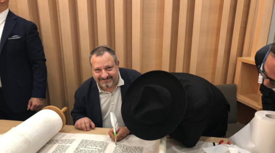 Giorgio Sinigaglia attending the writing of a Torah scroll in Milan, Italy. (Courtesy of the Jewish Community of Milan)