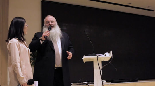 Rabbi Shimon Freundlich speaking at Family Hospital in Beijing, China in 2018. (Courtesy of Chabad China)