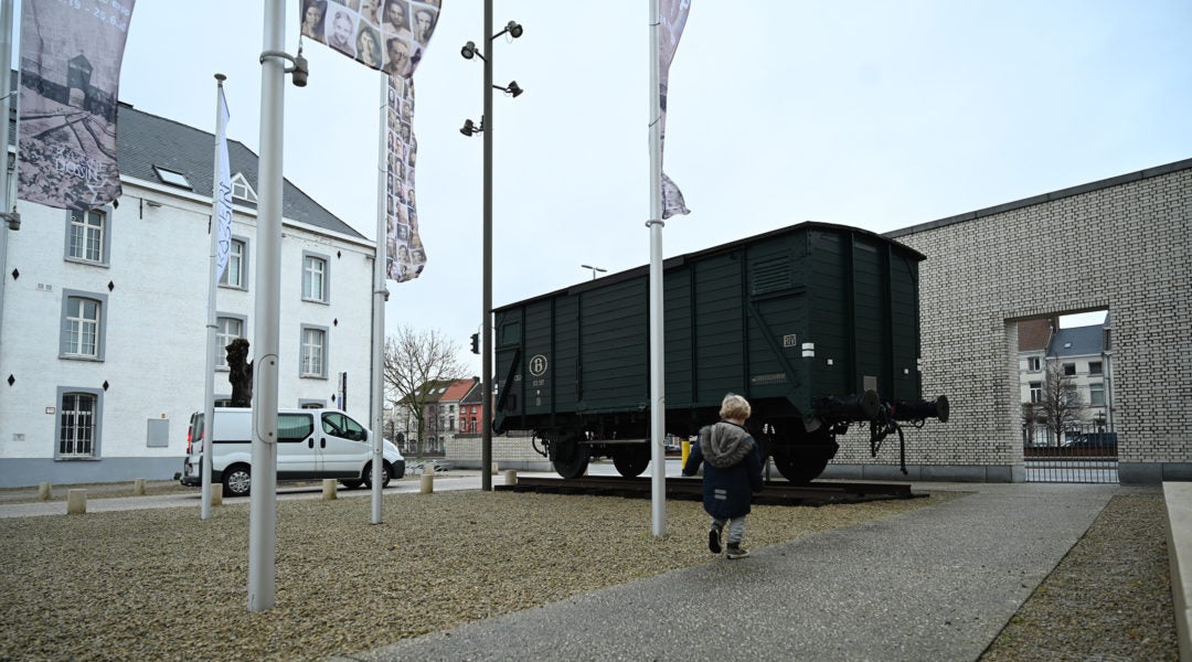 A boy visitng the Kazerne Dossin Holocaust museum in Mechelen, Belgium on Dec. 22, 2019. (Cnaan Liphshiz)