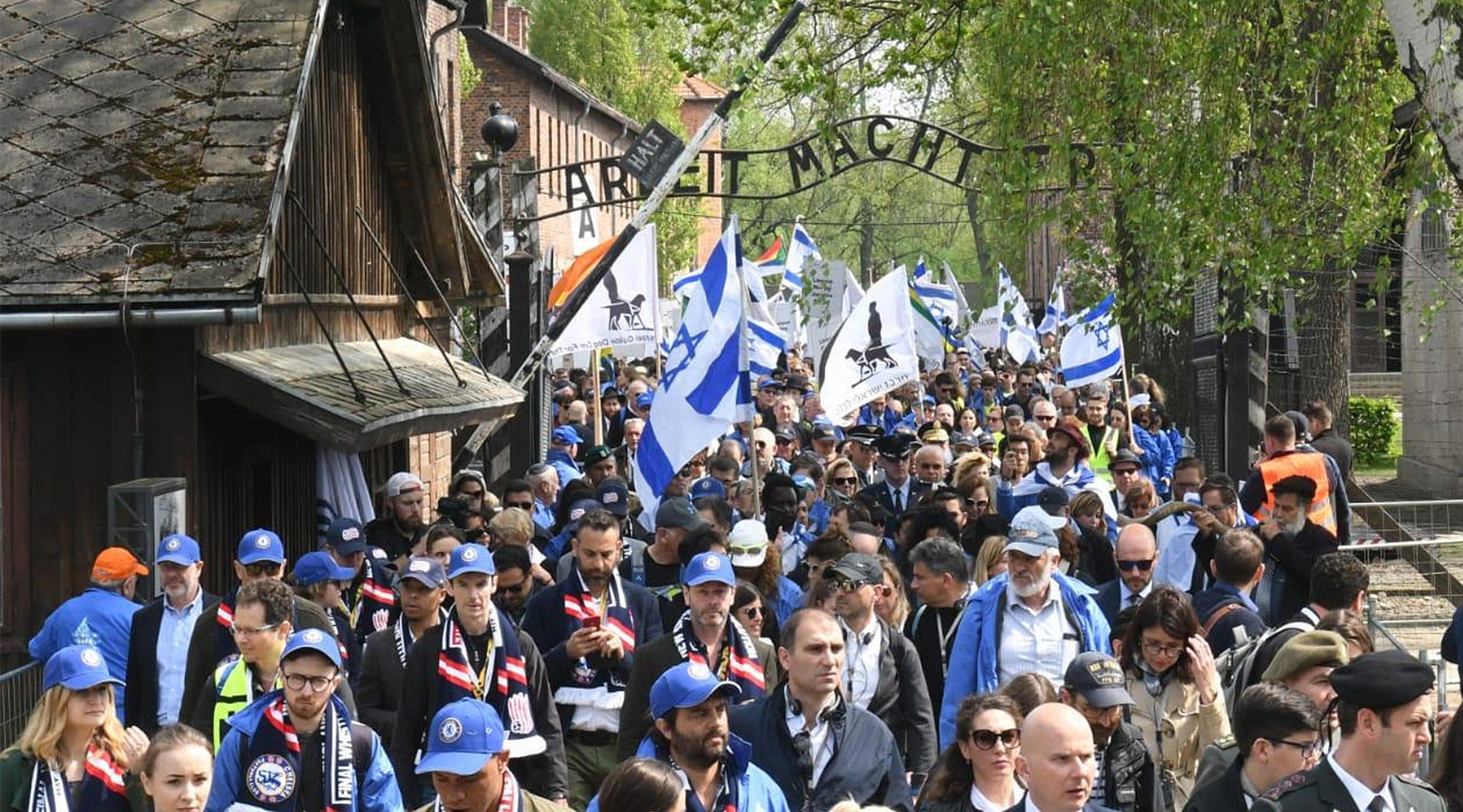 Participants of the March of the Living event exiting a gate in the former Nazi camp Auschwitz in Poland, May 2, 2019. (Courtesy of the International March of the Living)