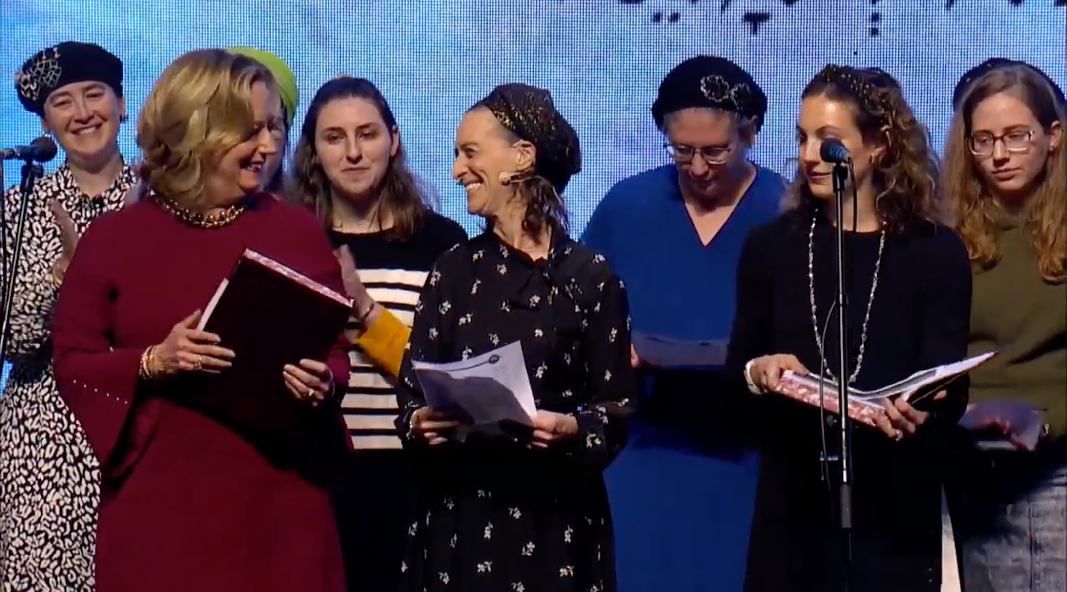 Women celebrate completing the seven-and-a-half-year cycle of Talmud study at a ceremony held by the organization Hadran in Jerusalem in January. (Screenshot from YouTube)