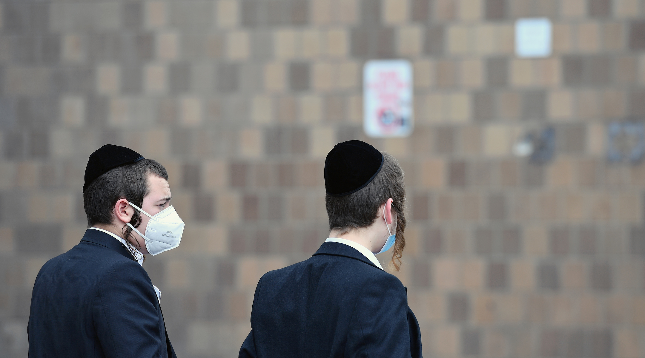 Two Orthodox men wear facemasks in New York City on March 31, 2020. The new coronavirus has spread at an especially high rate through Orthodox neighborhoods in New York. (Angela Weiss/AFP via Getty Images)