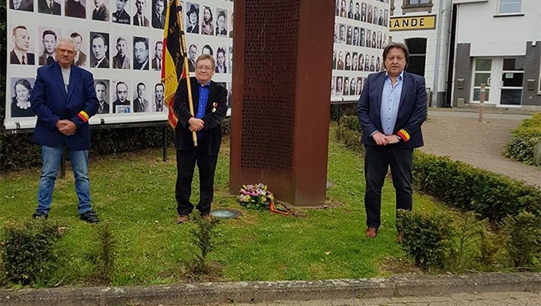 Michel Baert, right, and two commemoration activists laying a wreath at a Holocaust monument in Boortmeerbeek, Belgium on April 19, 2020. (Michel Baert)