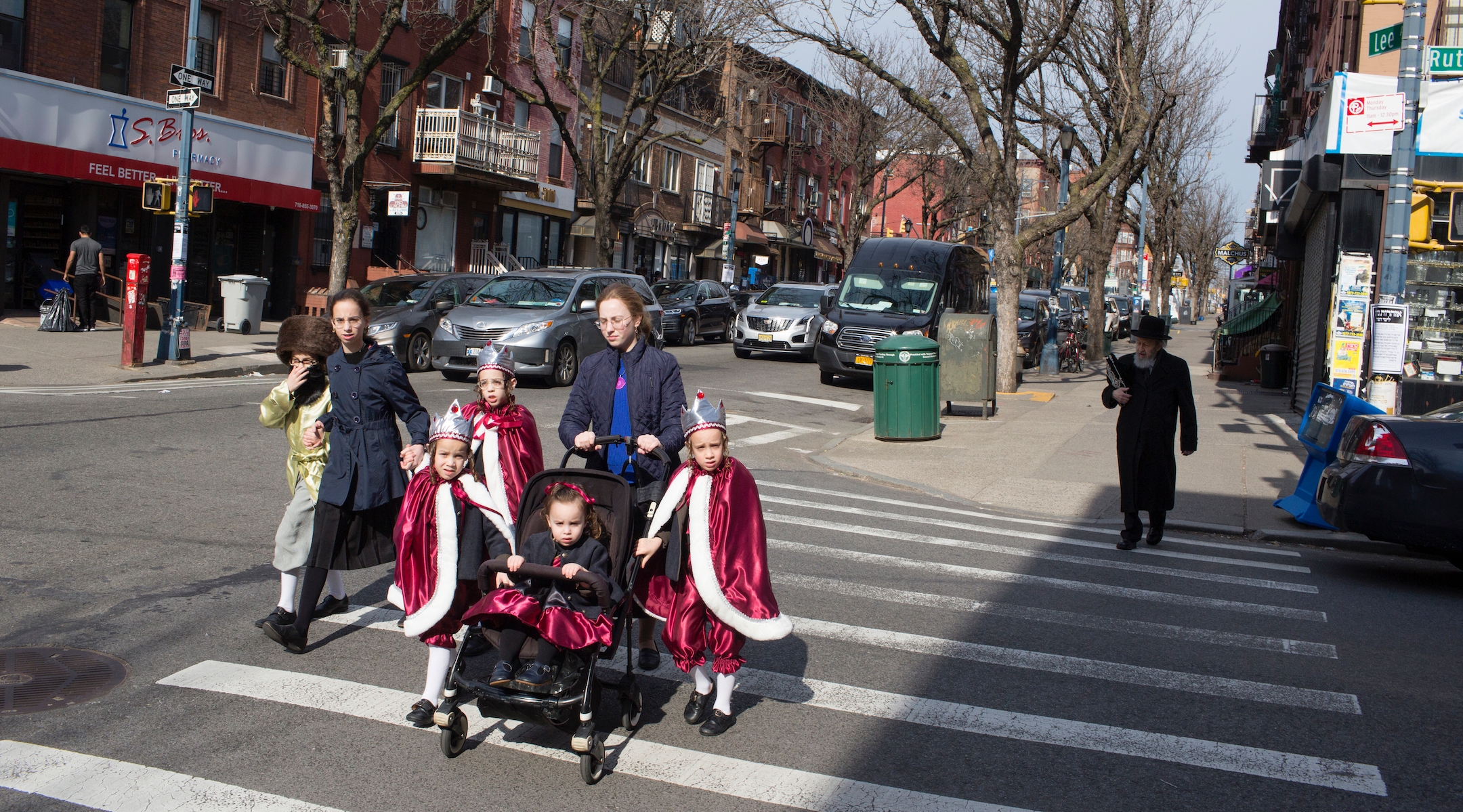 A Hasidic family, dressed up for Purim, crosses the street on March 10, 2020 in the Brooklyn neighborhood of Williamsburg. (Andrew Lichtenstein/Getty Images)