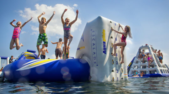 Campers playing on the water at Camp Modin. The camp is perhaps the first Jewish camp in the country to announce, in detail, how it plans to open. (Courtesy of Camp Modin)