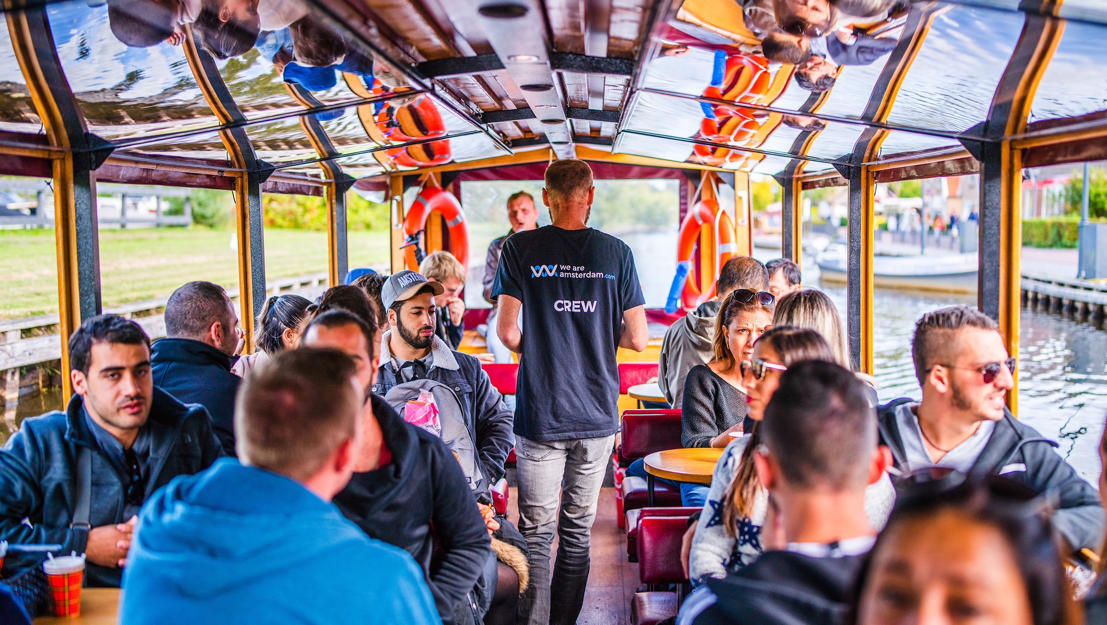 Tourists participate in a We Are Amsterdam canal tour operator in the center of Amsterdam, the Netherlands in 2019. (Courtesy of We Are Amsterdam)