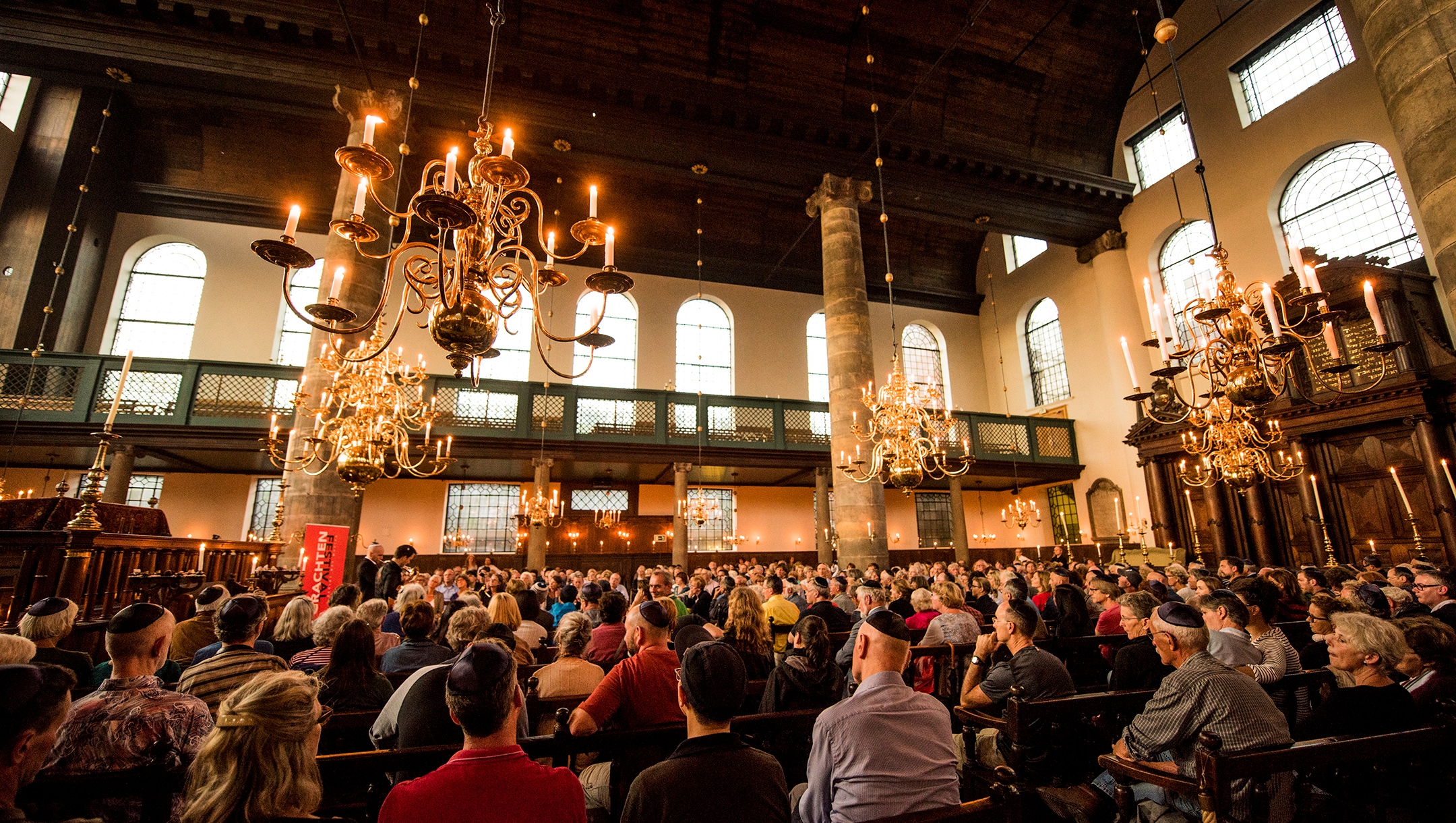 People attend a concert inside the Portuguese Synagogue at the Jewish Cultural Quarter of Amsterdam, the Netherlands on Aug. 17, 2017. (Cnaan Liphshiz)