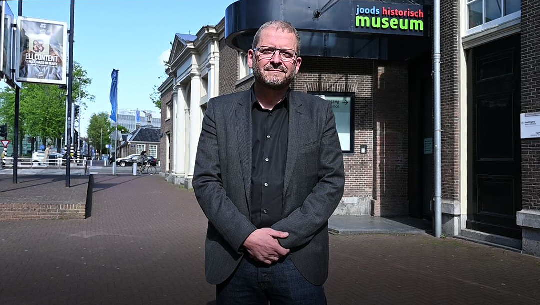 Emile Schrijver, director of the Jewish Cultural Quarter, stands outside that institution in Amsterdam, the Netherlands on May 4, 2020. (Cnaan Liphshiz)