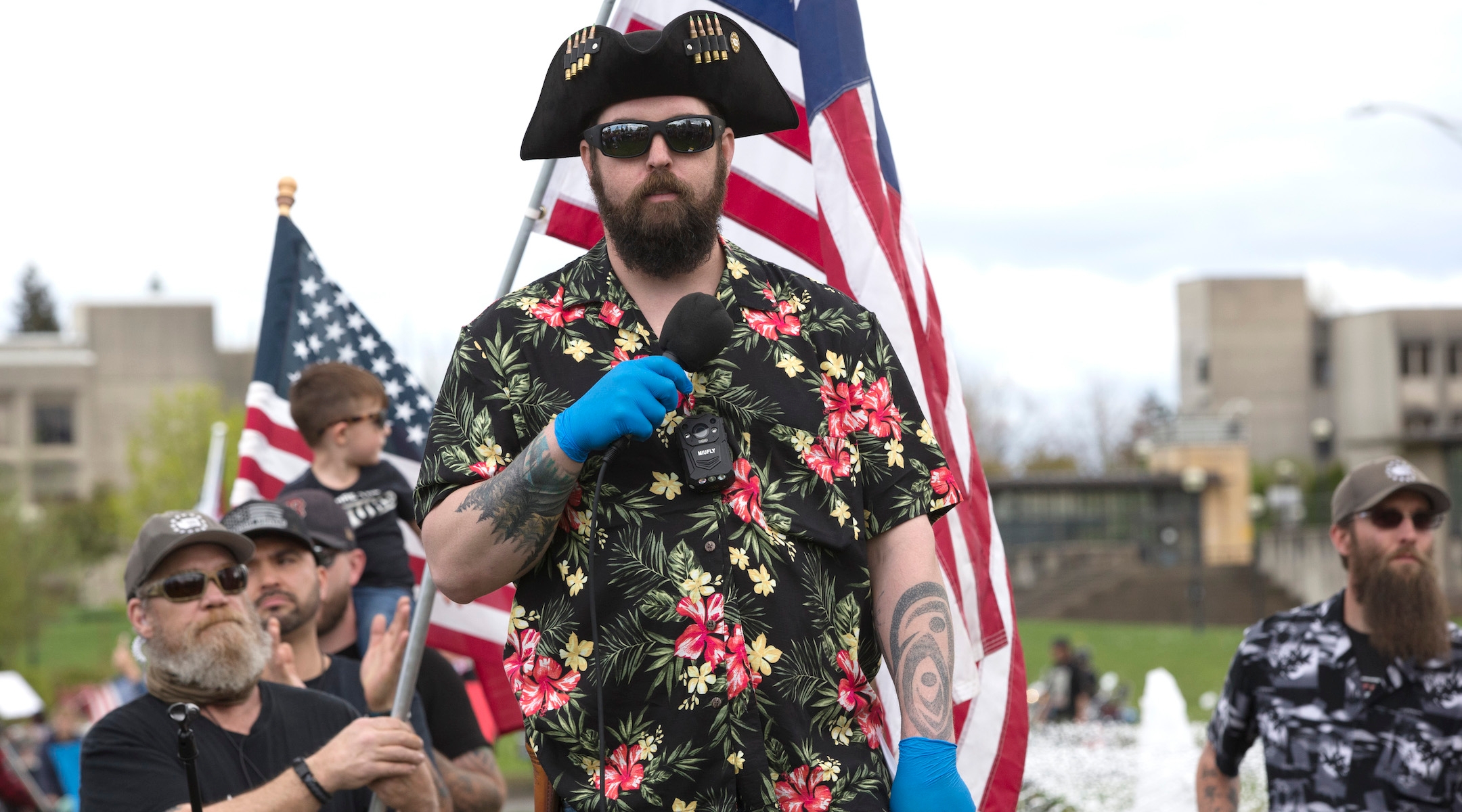 Matt Marshall of the right-wing group Washington State Three Percent (3%), and clad in the Boogaloo uniform of a Hawaiian shirt, speaks at a 'Hazardous Liberty! Defend the Constitution!' rally to protest the stay-at-home order, at the Capitol building in Olympia, Washington on April 19, 2020. (Karen Ducey/Getty Images)