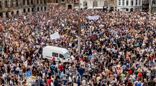 Thousands of protesters defying social distancing measures at a protest over the death of George Floyd on Dam Square in Amsterdam, the Netherlands on June 1, 2020. (Robin Utrecht/SOPA Images/LightRocket via Getty Images)