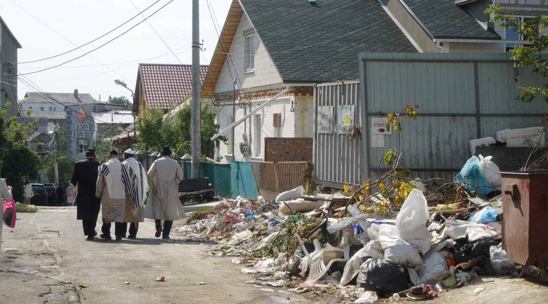 Jewish men walk down a street in the Pushkin area of Uman, Ukraine of ‎Sept. ‎9, ‎2017. (Cnaan Liphshiz)