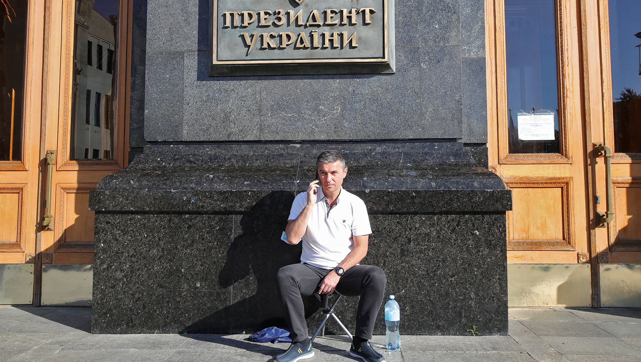 Oleksandr Tsebriy, the mayor of Uman, speaks on the phone outside the Cabinet of Ministers of Ukraine, Kyiv, Ukraine on Aug. 17, 2020. (Pavlo Bahmut/ Ukrinform/Barcroft Media via Getty Images)