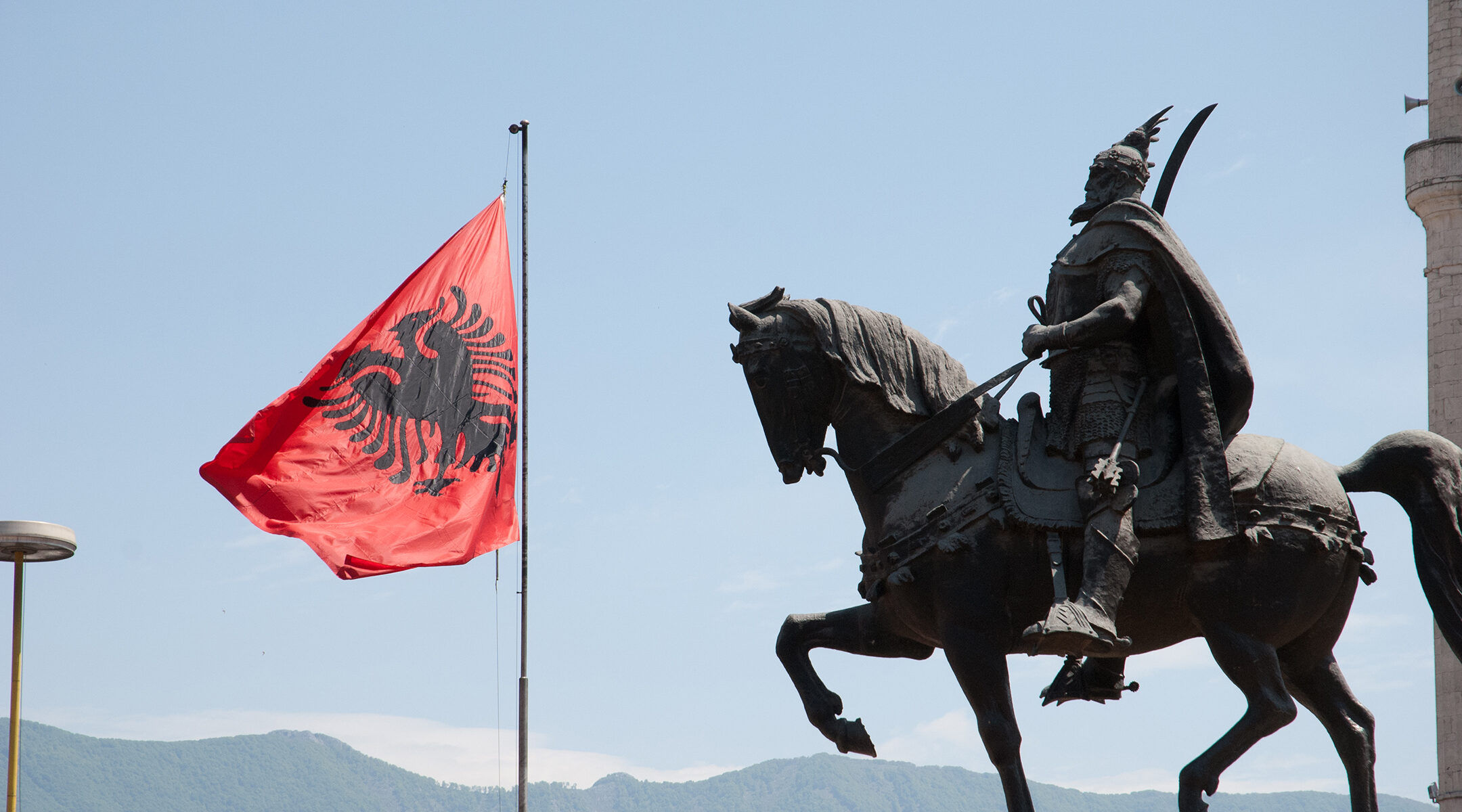 The Albanian flag flies over Skanderbeg Square in Tirana, Albania on May 12, 2010. (Flickr/Thomas Quine)