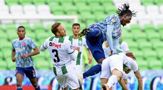 Socccer players from FC Groningen and Ajax play at a champion's league match at the Hitachi Capital Mobility stadium in Groningen, the Netherlands on Oct. 4, 2020. (Olaf Kraak/ANP Sport via Getty Images)