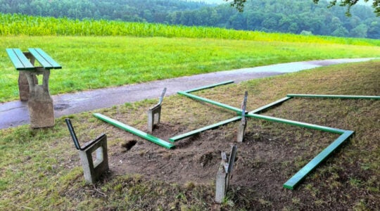 Parts of a vandalized picnic table arranged in the shape of a swastika near the Jewish cemetery of Krumbach, Germany in 2020. (AllgaeuRechtsaussen)