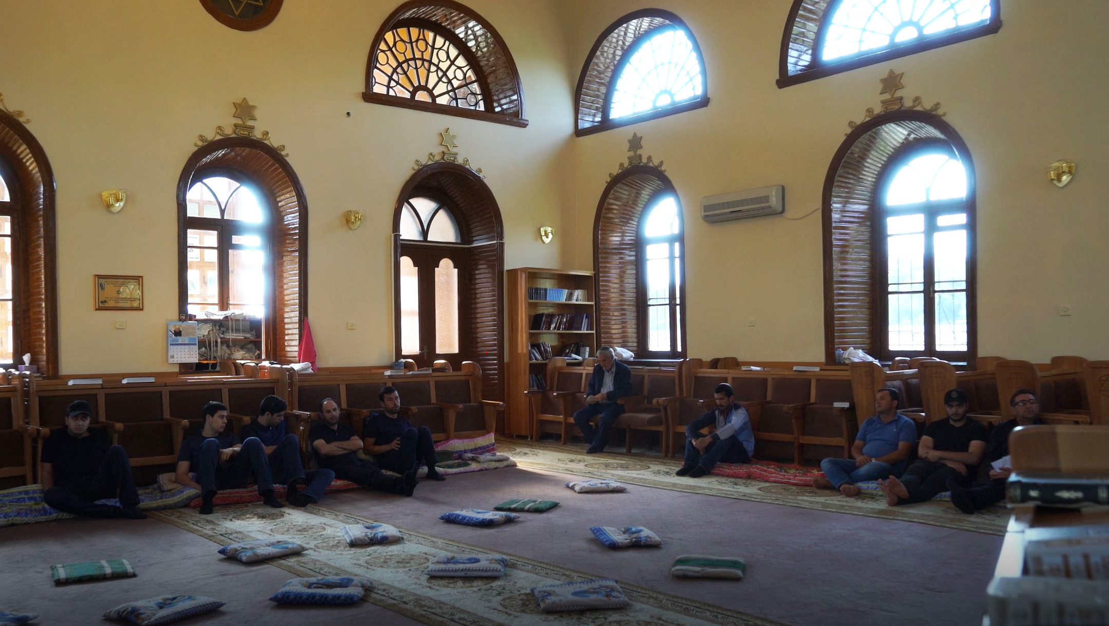 Men pray at the Six Dome Synagogue of Krasnaiya Sloboda, Azerbaijan on July 21, 2018. (Cnaan Liphshiz)