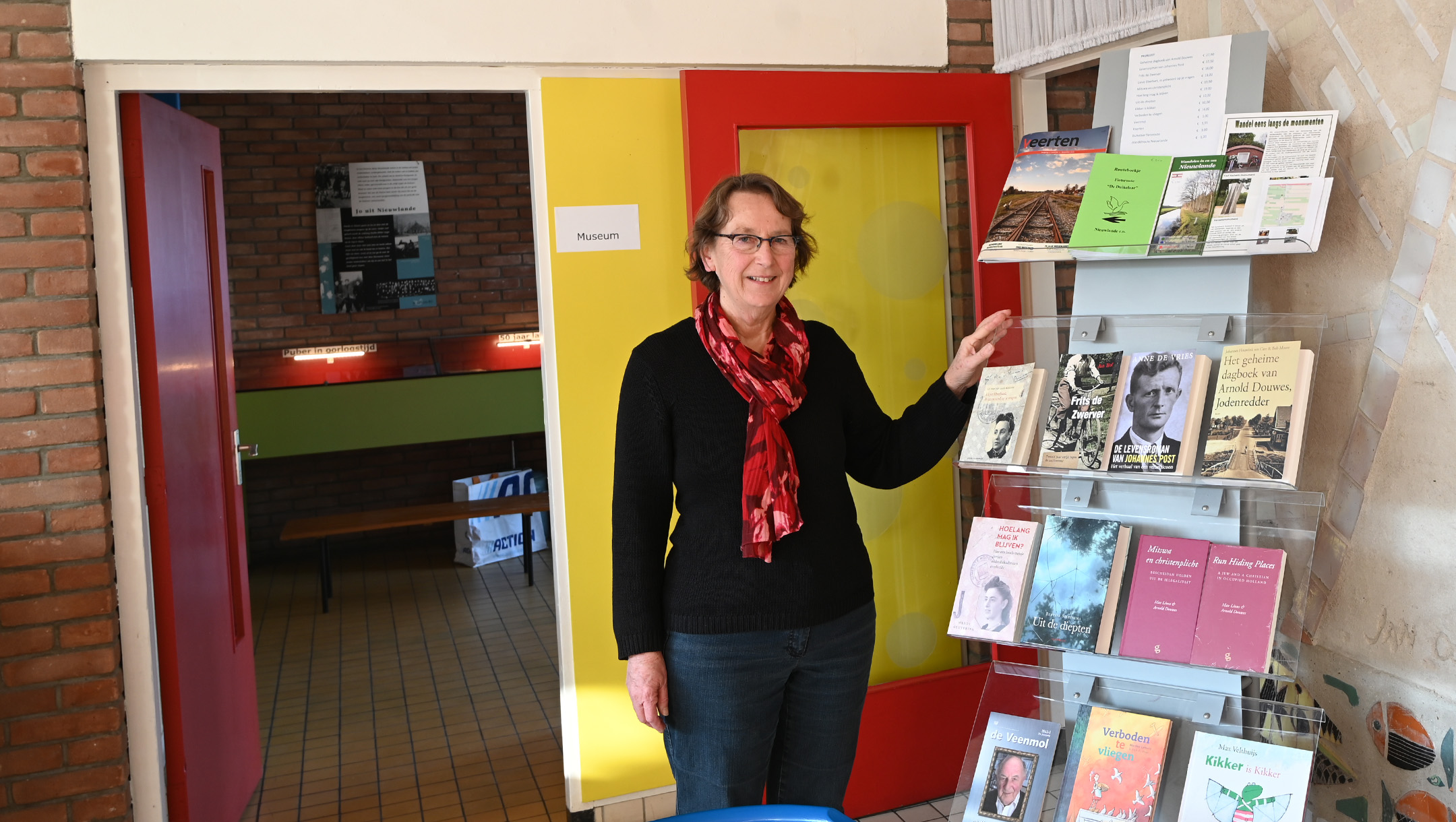 Hanneke Rozema greets visitors at the De Duikelaar museum in Nieuwlande, the Netherlands on Jan. 25, 2021. (Cnaan Liphshiz)