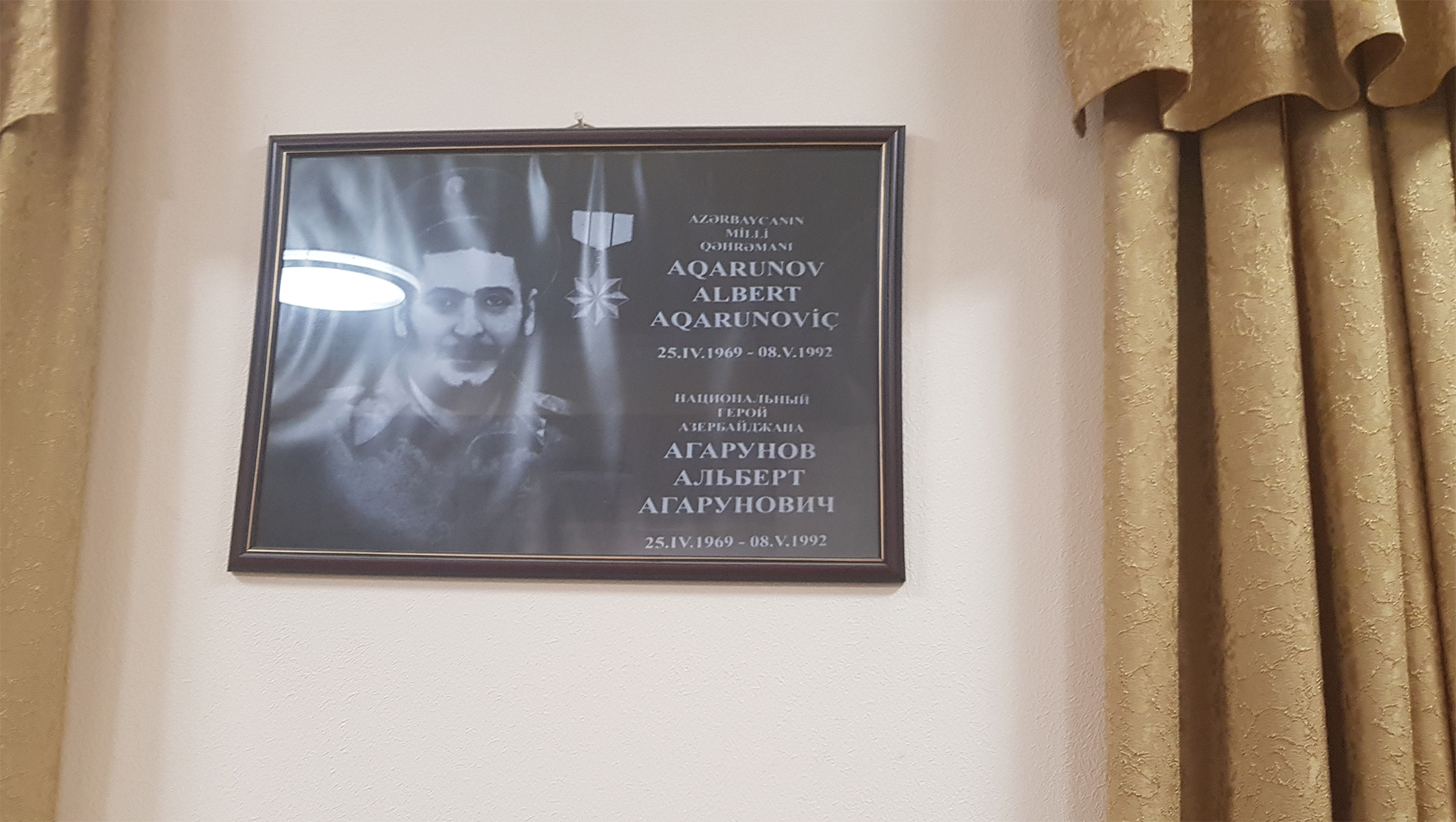 A picture of a Jewish casualty of war from 1992 hangs in the Georgian Synagogue of Baku, Azerbaijan in July 2018. (Cnaan Liphshiz)