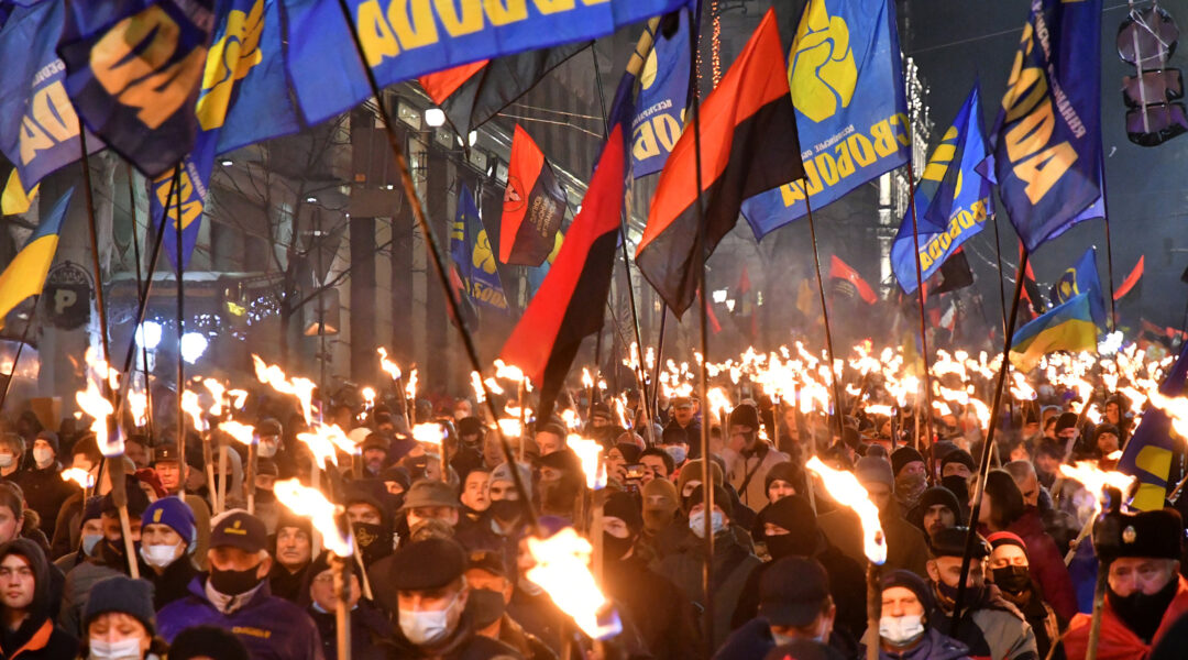 Participants of an annual event in honor of Stepan Bandera march through Kyiv, Ukraine on Jan. 1, 2021. (Genya Savilou/AFP via Getty Images)