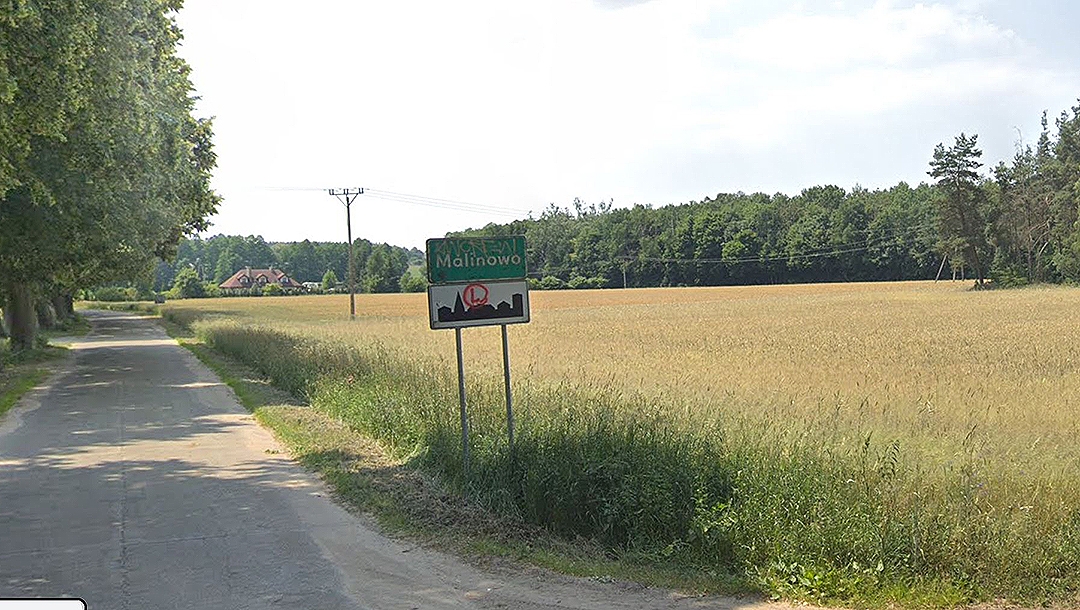 A sign at the entrance to the village of Malinowo, Poland. (Google Maps)