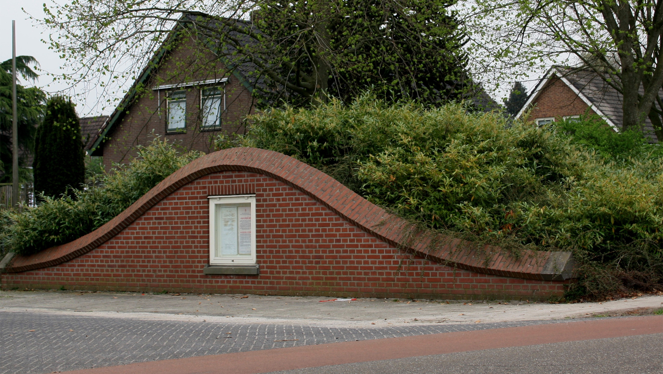 A copy of a certificate from Yad Vashem features prominently on the wartime monument of Nieuwlande, the Netherlands, which is designed to resemble a dugout for hiding Jews during the Holocaust. (Wikimedia Commons)