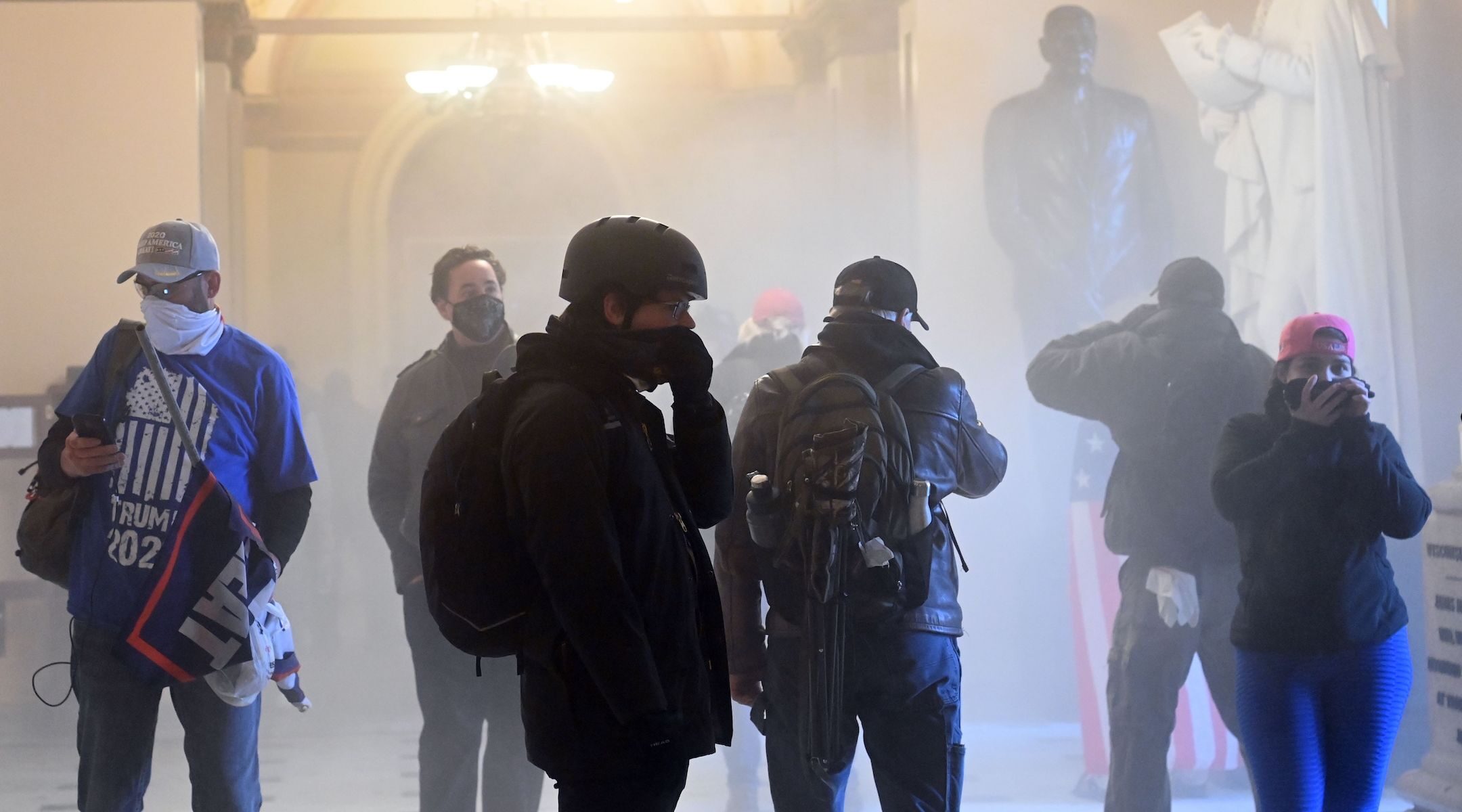A pro-Trump mob enters the US Capitol as tear gas fills the corridor on January 6, 2021. (Saul Loeb/AFP via Getty Images)