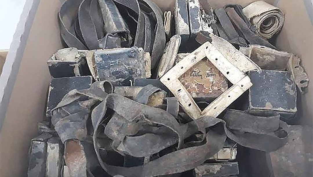 10 sets of tefillin that the Shem Olam Holocaust museum said were found in Warsaw, Poland. (Courtesy of Shem Olam Faith & the Holocaust Institute for Education, Documentation & Research)