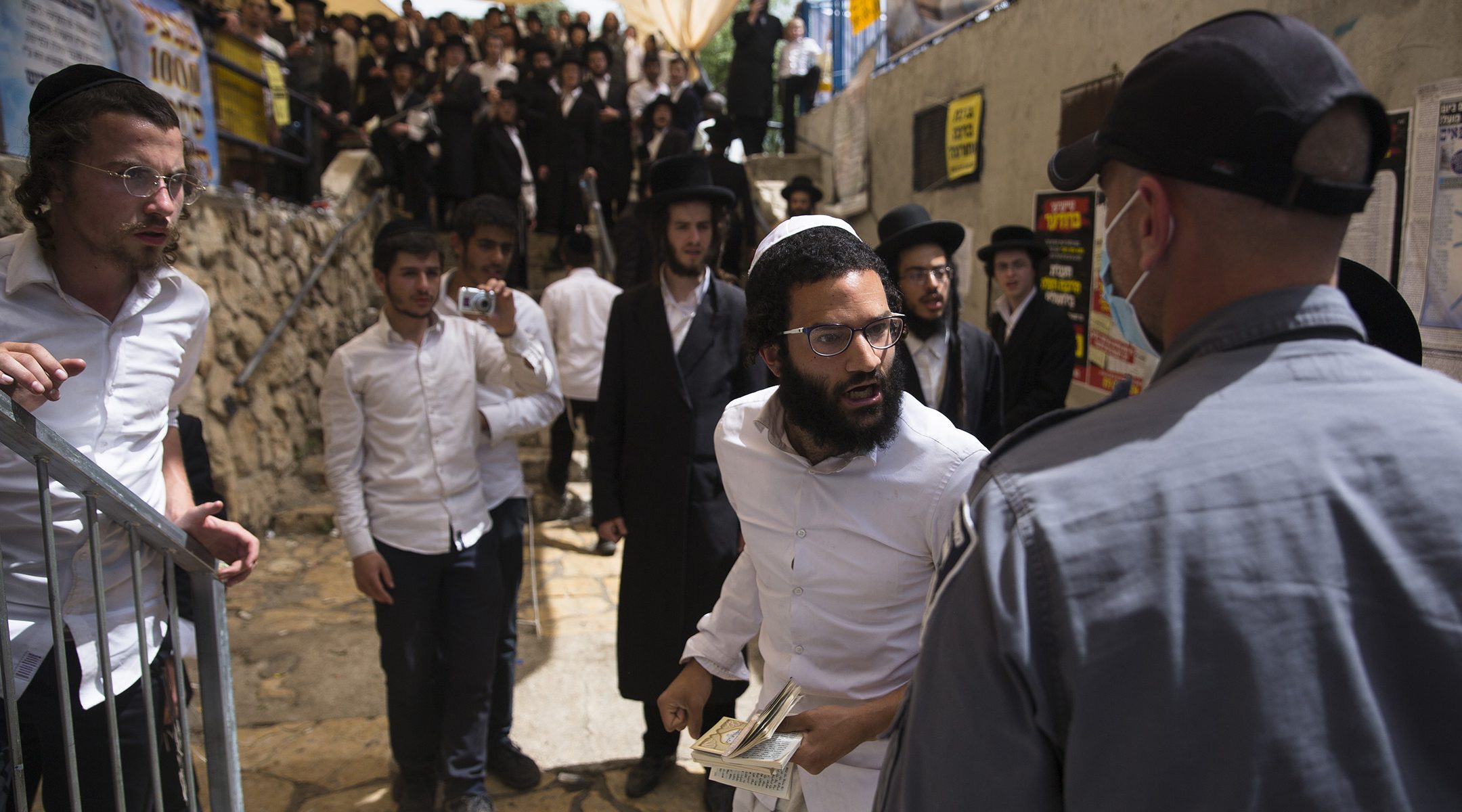 Mourners gather during the funeral of one of those who died in a stampede during the Jewish religious festival of Lag Ba'Omer at the Jewish Orthodox pilgrimage site of Mount Meron in Israel on April 30, 2021. (Ilia Yefimovich/picture alliance via Getty Images)