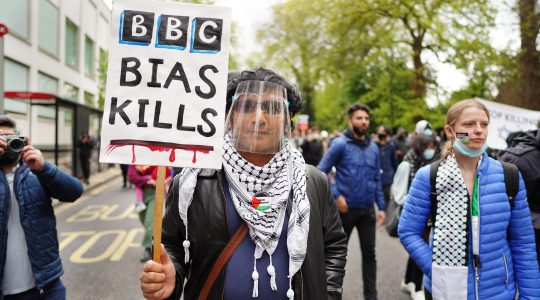 A protester marches in London, the UK at a rally again Israel’s actions in Gaza on May 16, 2021. (Alisdare Hickson)