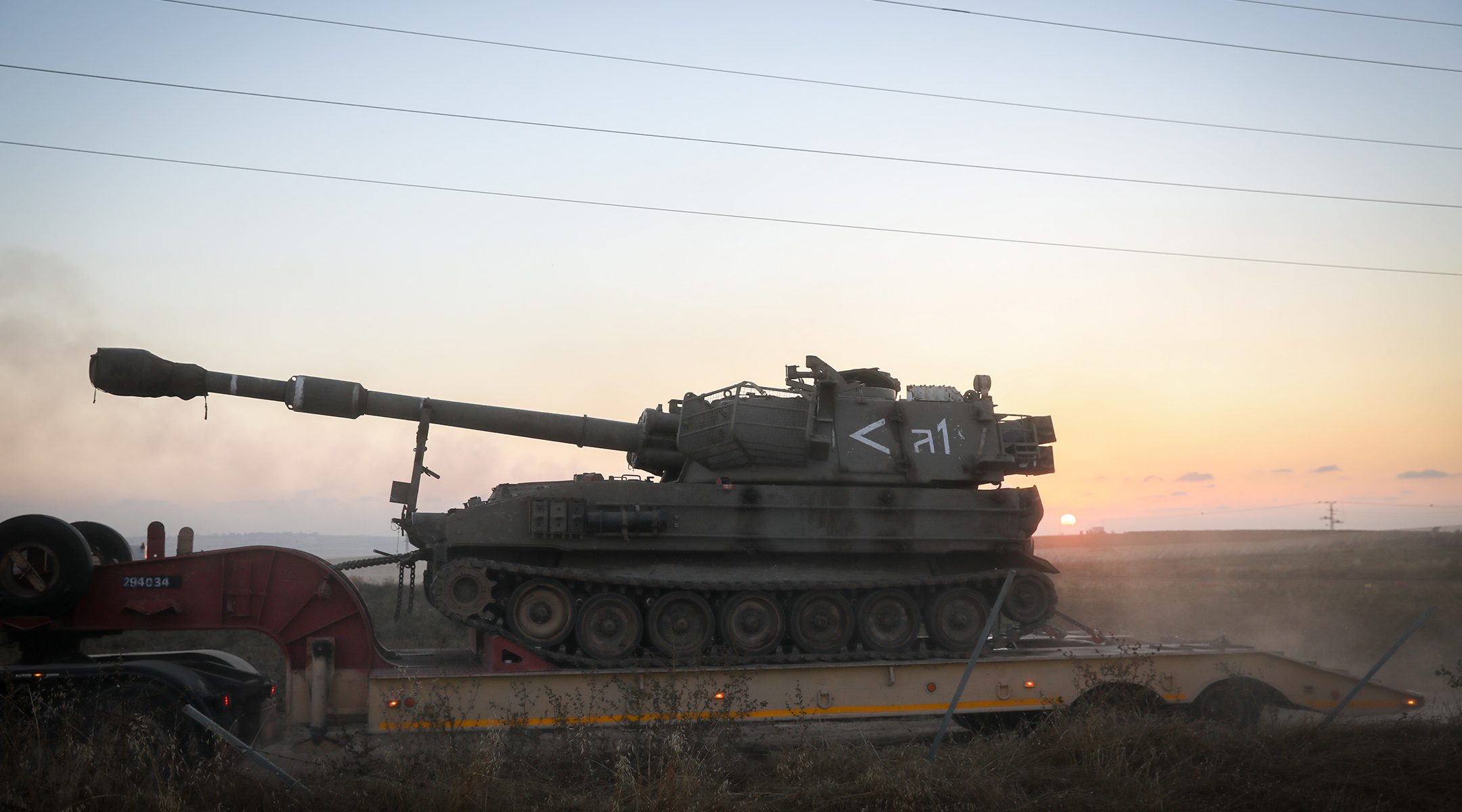 An Israel Defense Forces armoured vehicle is driven to the border with Gaza on May 13, 2021. (Noam Revkin Fenton/Flash90)