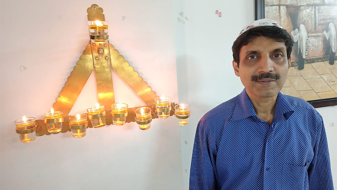 Herzel Simon celebrates Hanukkah at his home in Mumbai, India on Dec. 29, 2020. (Courtesy of Simon)