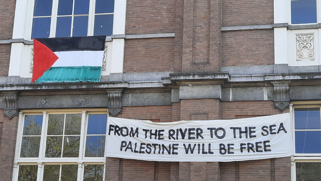 A banner about Israel hangs on the facade of the De Ateliers arts institution in Amsterdam, the Netherlands on May 28, 2021. (Barry Mehler)