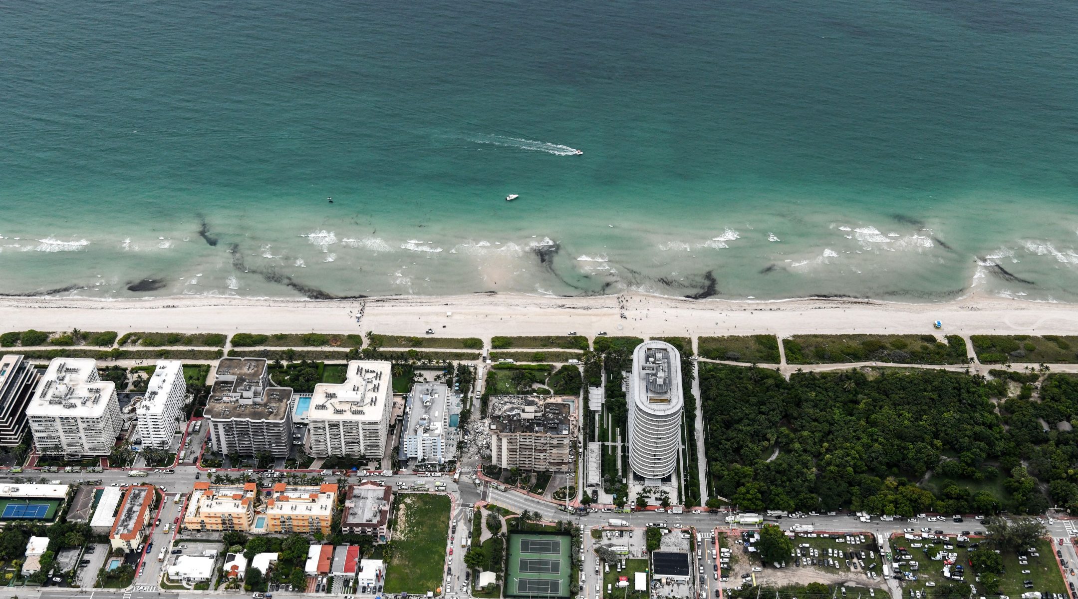 This aerial view shows search and rescue personnel working after the partial collapse of the Champlain Towers South in Surfside, north of Miami Beach, on June 24, 2021. (Chandan Khanna/AFP via Getty)