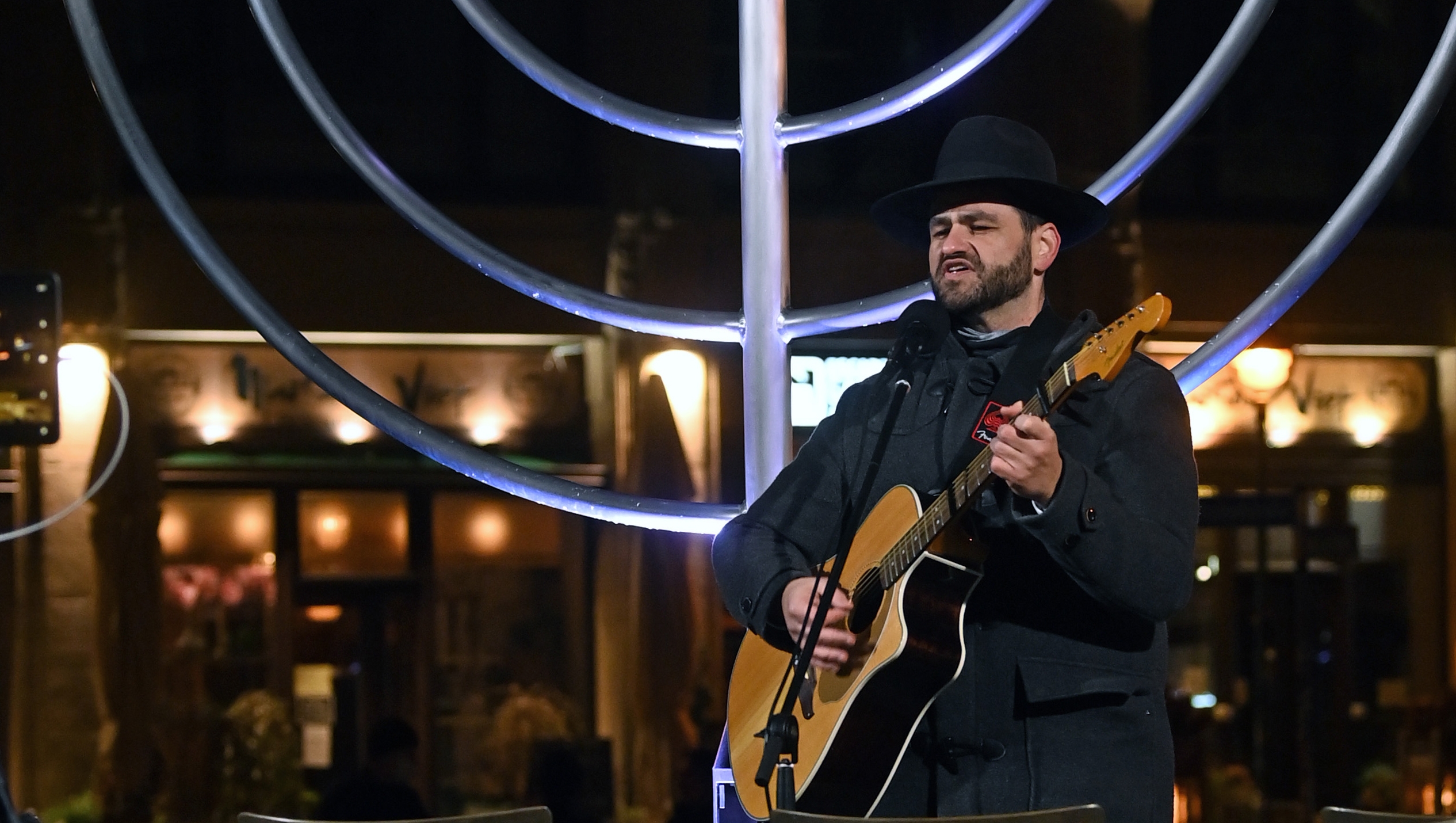 Rabbi Zsolt Balla sings at the memorial site of the former Great Synagogue of Leipzig, Germany on Dec. 10, 2020. (Hendrik Schmidt/picture alliance via Getty Images)