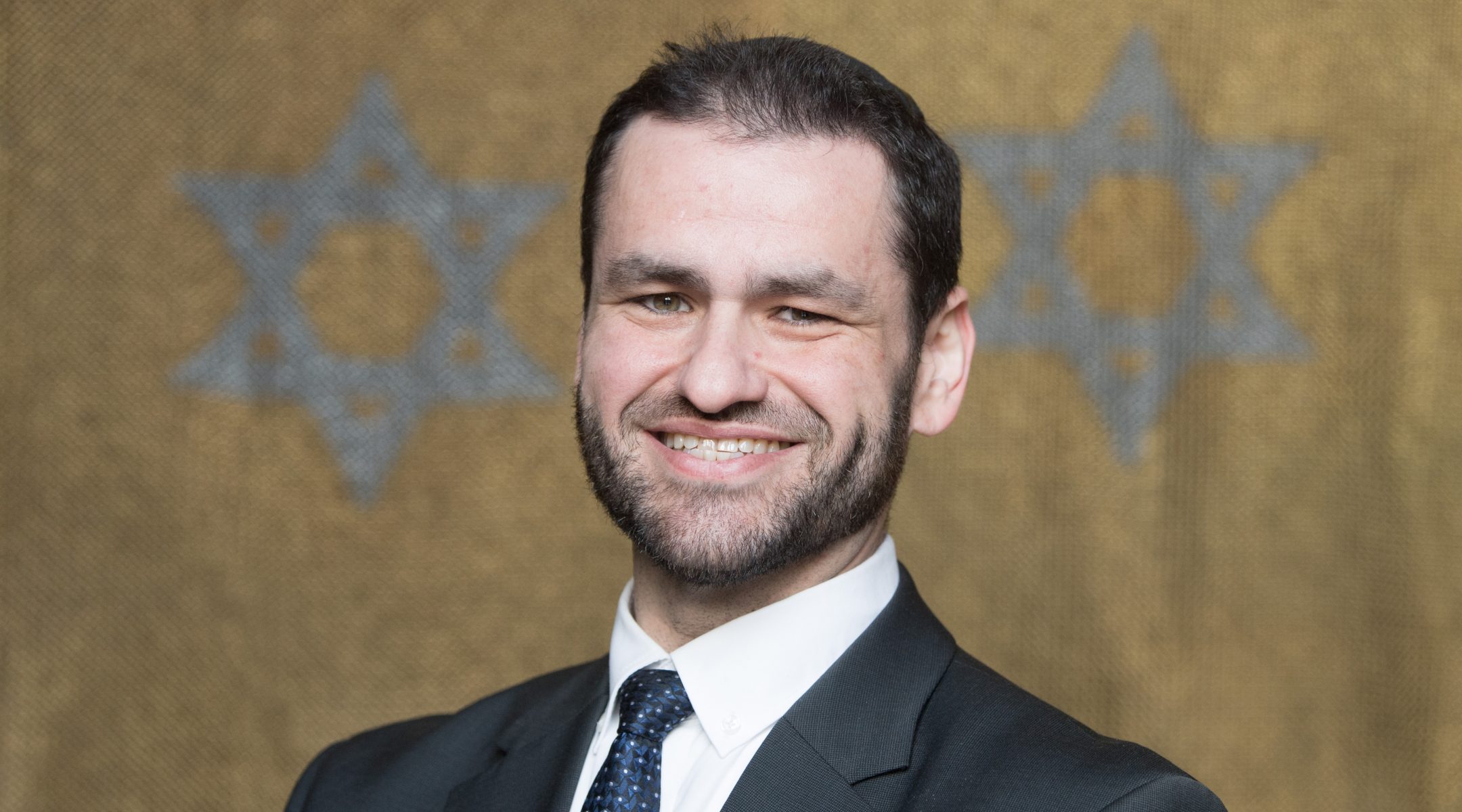 Zsolt Balla stands on the sidelines of a press conference in the synagogue of Dresden, Germany on January, 2019. (Sebastian Kahnert/picture alliance via Getty Images)