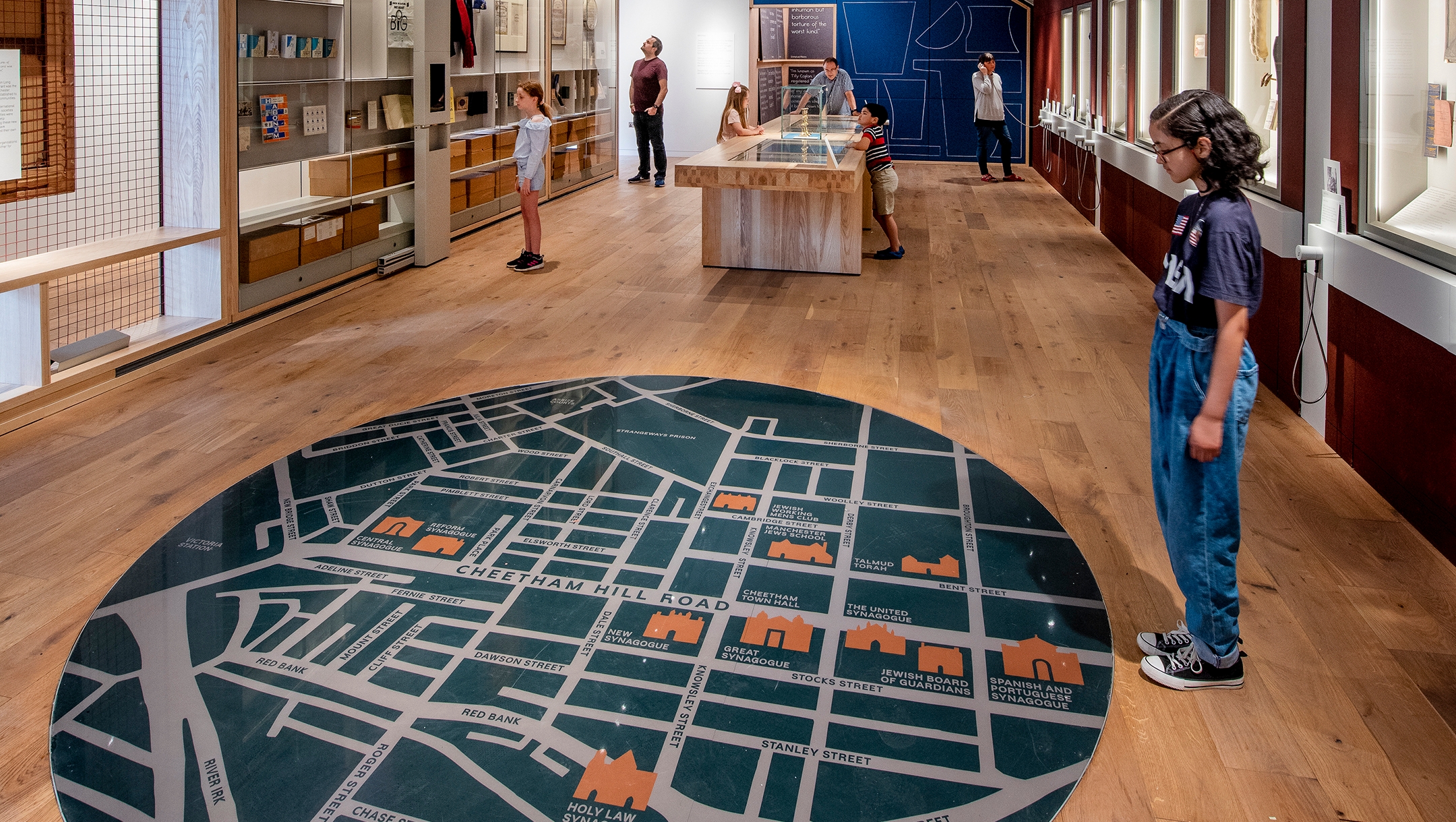 A child studies the giant map on the floor of the atrium of the Manchester Jewish Museum in Manchester, UK on June 4, 2021. (Chris Payne)