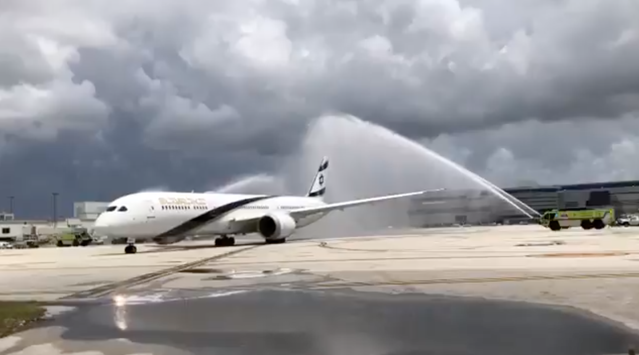 An El Al airplane carrying members of an Israel Defense Forces rescue team is given a "water salute" upon departing Miami on July 11, 2021. (Screenshot from Twitter)