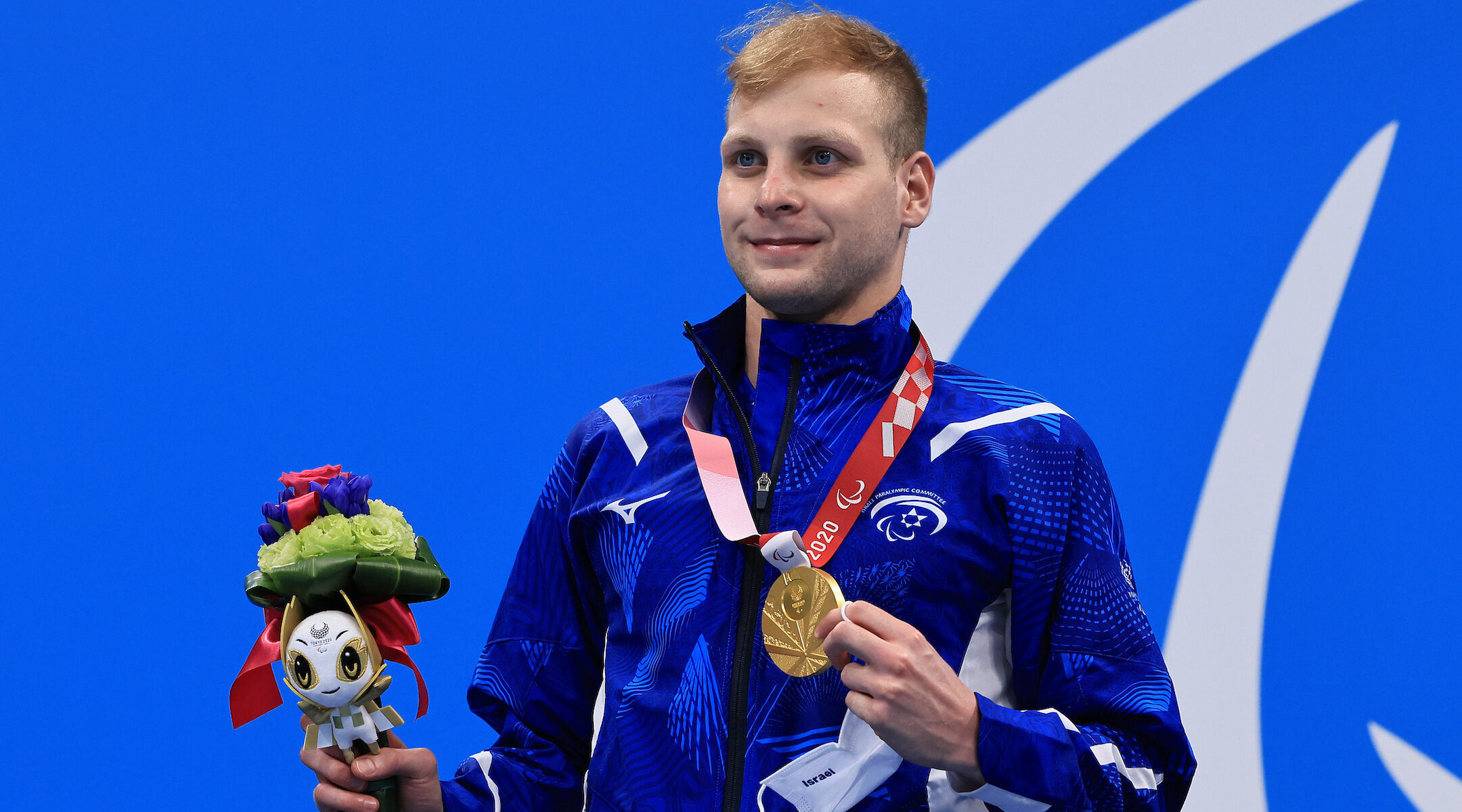 Mark Malyar poses during a medal ceremony
