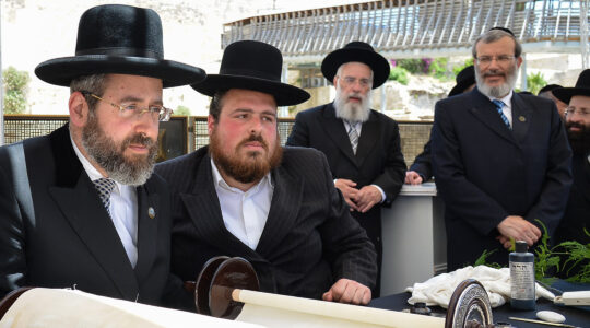 Chief Ashkenazi Rabbi David Lau, left, and other rabbis attend a Torah scroll completion ceremony in Jerusalem, Israel on June 15, 2015. (Eli Segal)