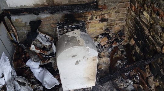 The torched grave of a daughter of Rabbi Nachman of Breslov in Kremenchuk, Ukraine in 2015. (Oholei Tzadikim)