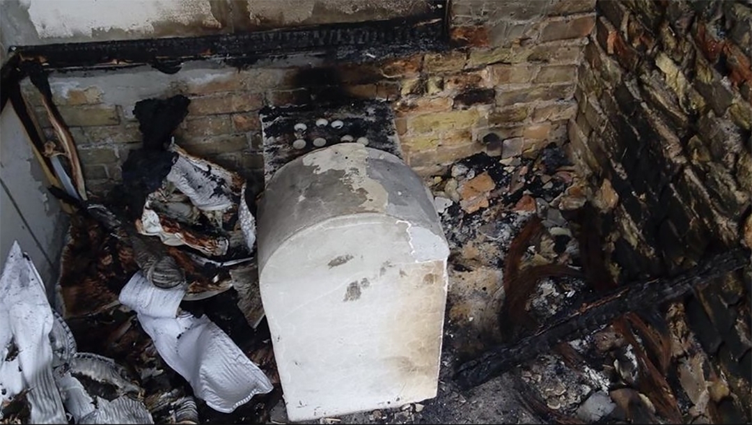 The torched grave of a daughter of Rabbi Nachman of Breslov in Kremenchuk, Ukraine in 2015. (Oholei Tzadikim)