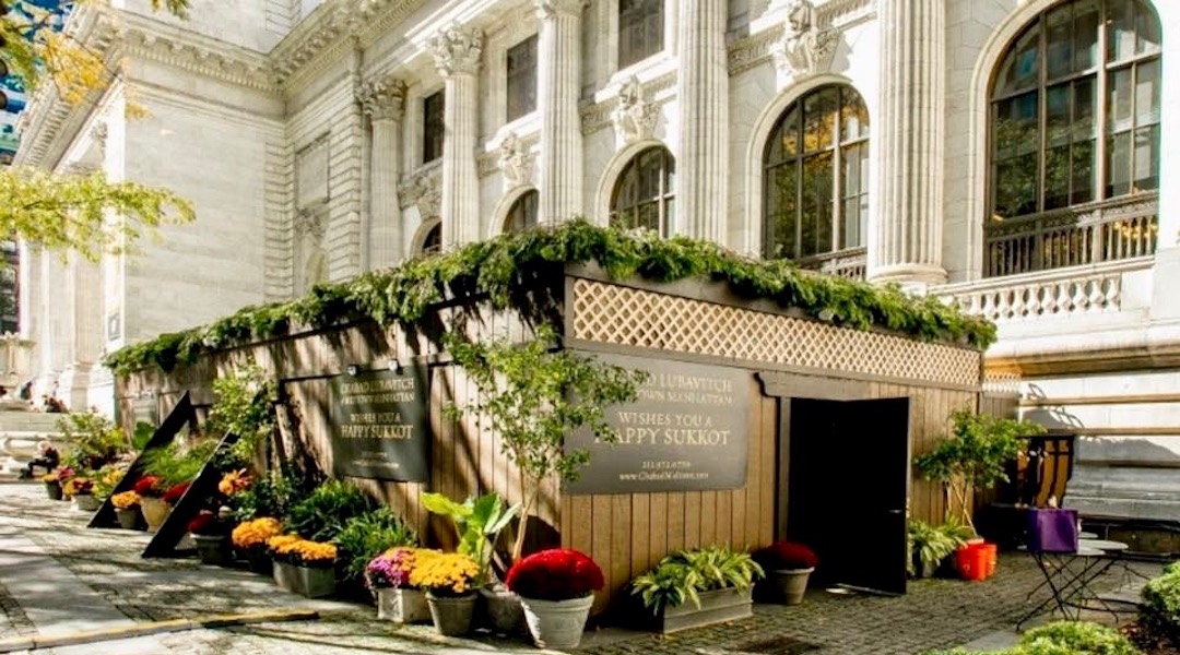 Chabad of Midtown Manhattan has constructed a sukkah in Bryant Park, behind the New York Public Library. (Chabad of Midtown Manhattan)