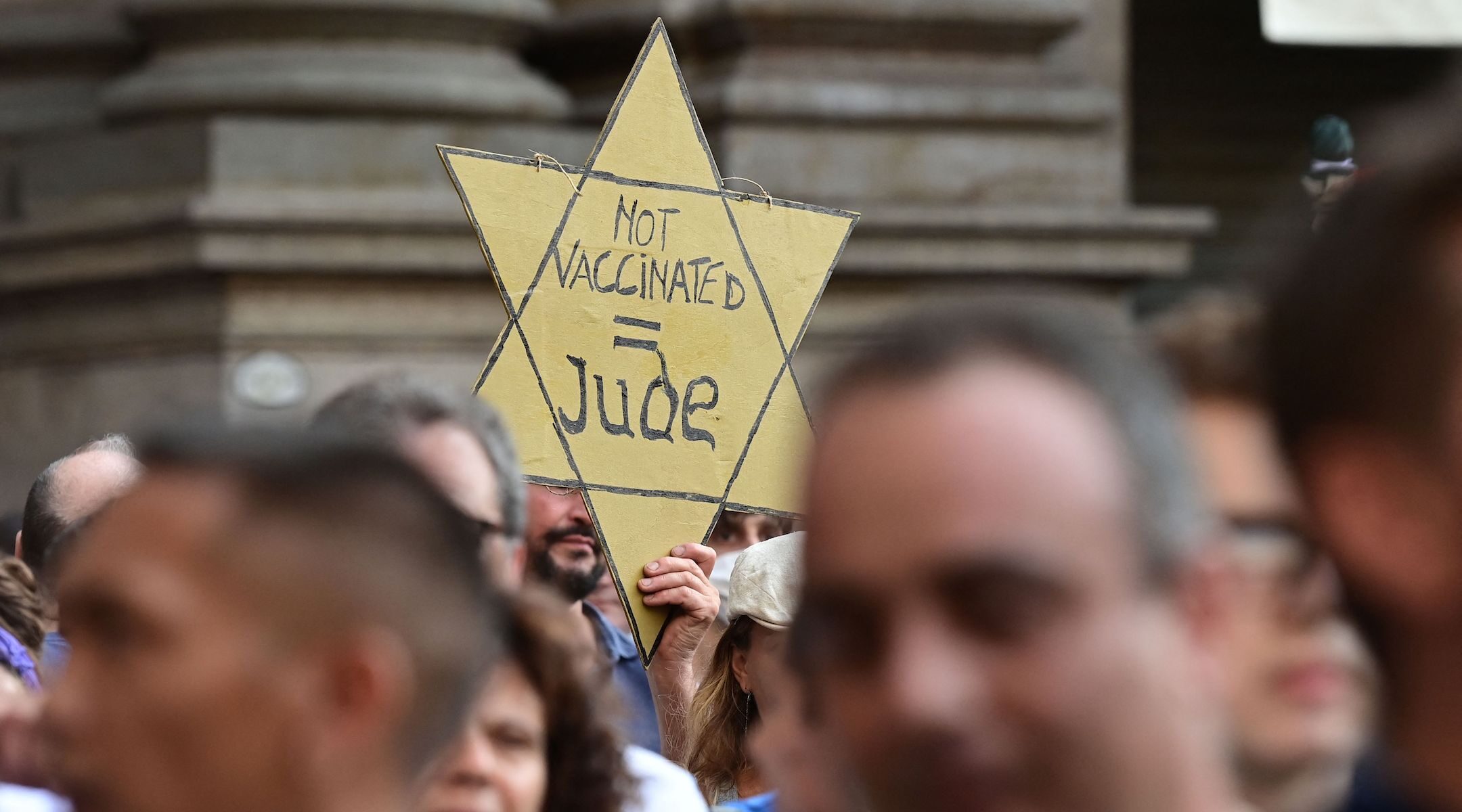 a yellow star reading "not vaccinated=jew"