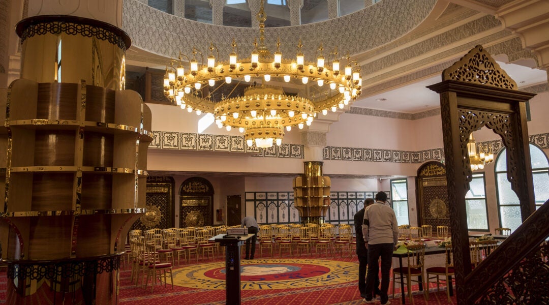 Visitors study the Grande Mosque in the district of Empalot in Toulouse, on June 23, 2018. (Eric Cabanis/AFP via Getty Images)